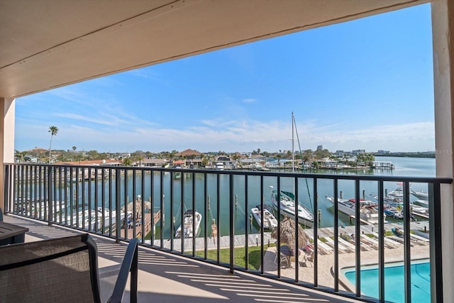 balcony featuring a water view