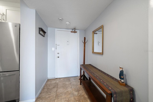 entryway with a textured ceiling