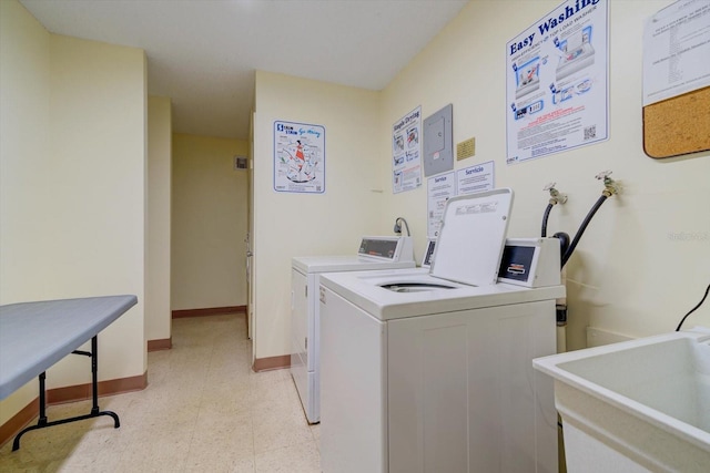 washroom featuring sink and washing machine and dryer