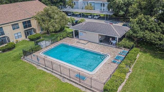 view of pool featuring a yard and a patio area