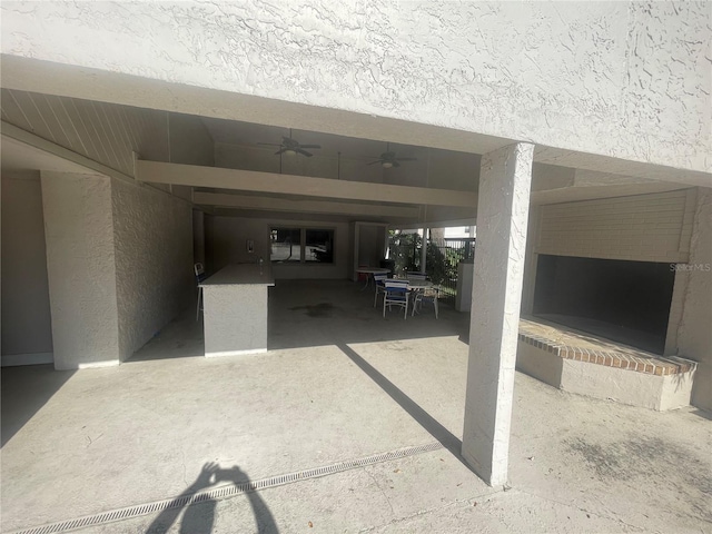 view of patio featuring ceiling fan