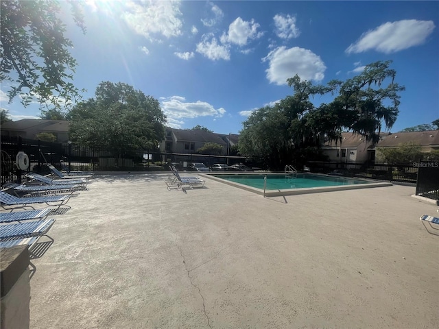 view of swimming pool with a patio