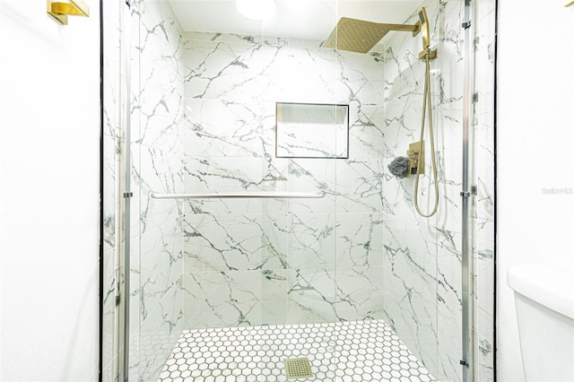 bathroom featuring walk in shower and toilet