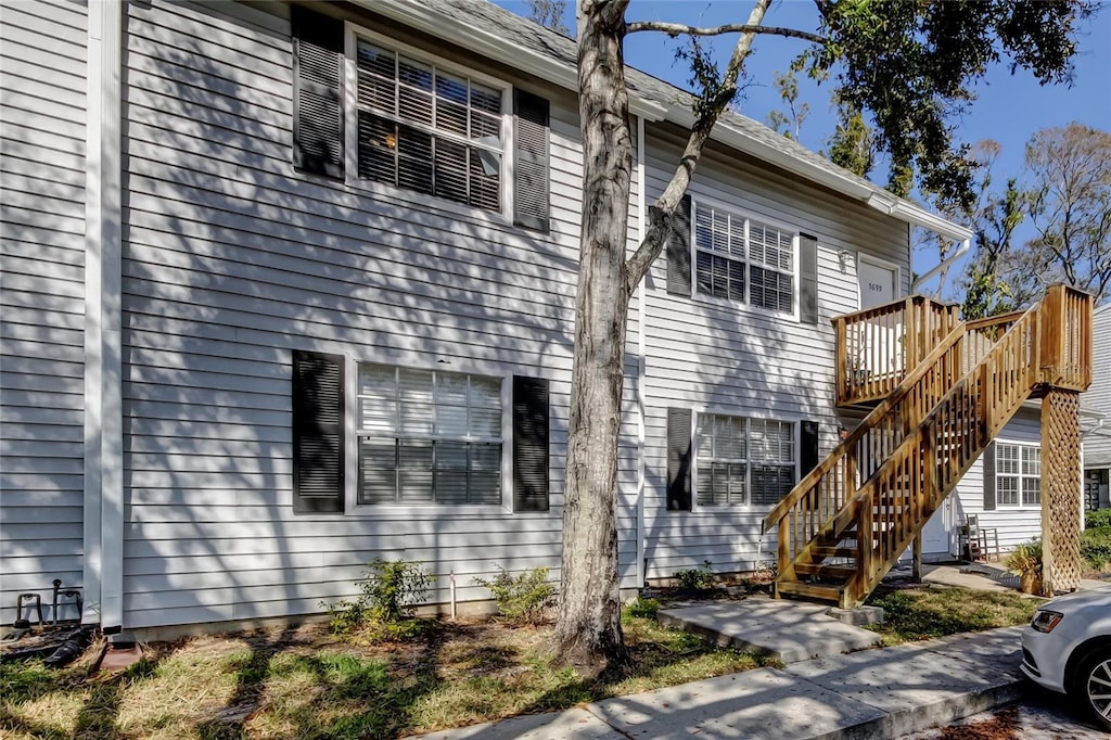 view of property exterior with a deck