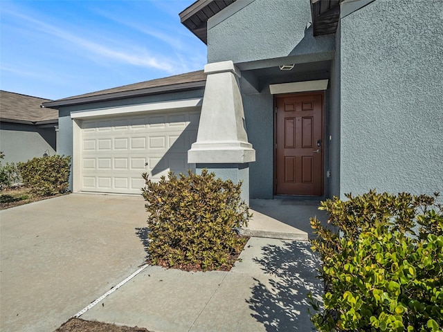 entrance to property featuring a garage