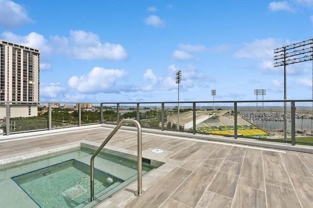 view of pool featuring a hot tub