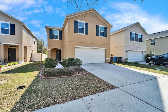 view of front of home featuring a garage and a front yard