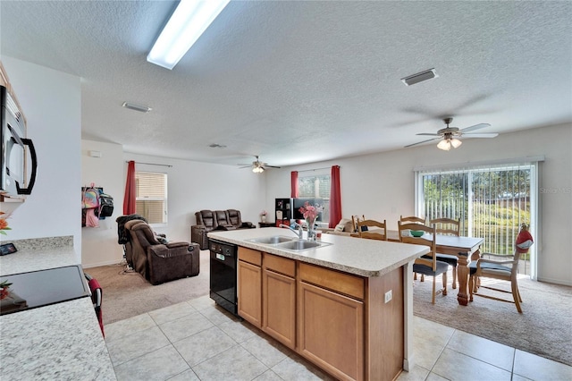 kitchen with light colored carpet, light countertops, open floor plan, a sink, and dishwasher