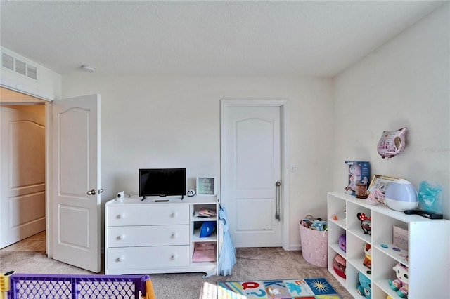 bedroom with light colored carpet and visible vents