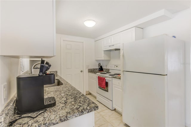 kitchen featuring white cabinetry, dark stone countertops, white appliances, and light tile patterned flooring