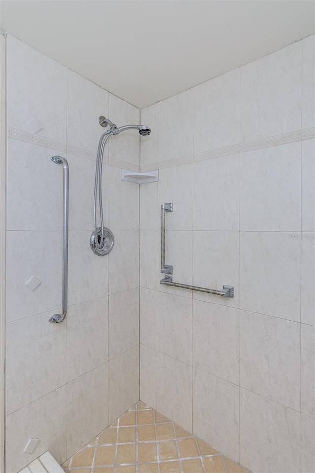 bathroom with tiled shower