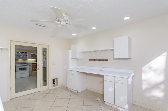 bathroom with tile patterned floors and ceiling fan