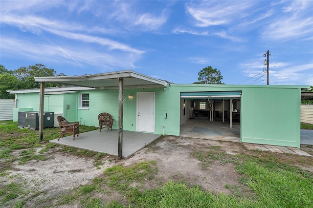 back of property featuring central air condition unit