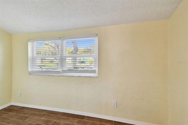 spare room featuring a textured ceiling