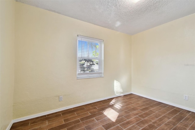 spare room featuring a textured ceiling