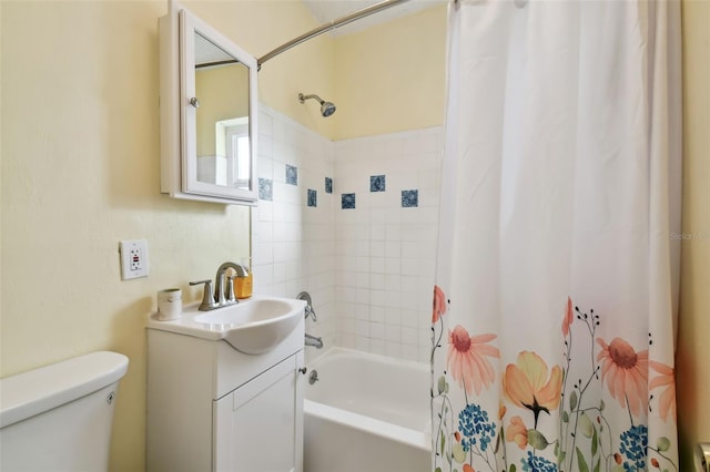 full bathroom with vanity, toilet, and shower / bath combo with shower curtain