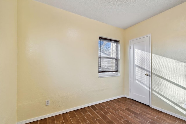 empty room featuring a textured ceiling