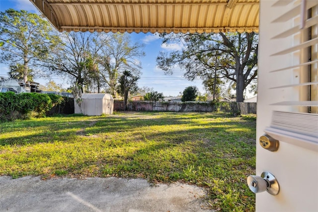 view of yard with a storage shed