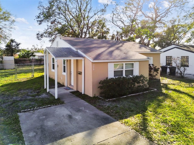 view of side of home featuring a yard