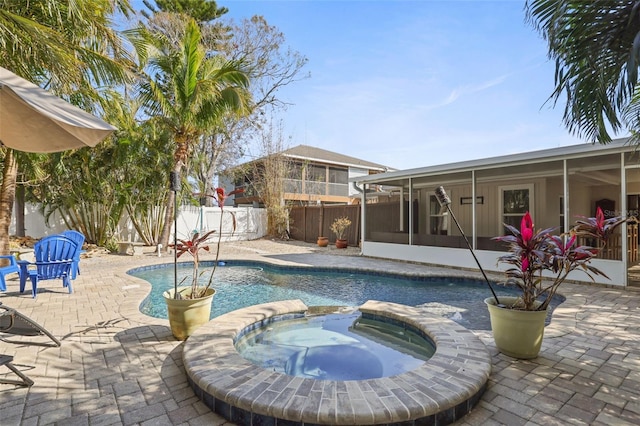 view of swimming pool featuring an in ground hot tub, a patio, and a sunroom