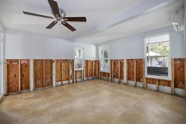 unfurnished room featuring beamed ceiling, a wall mounted air conditioner, and wooden walls