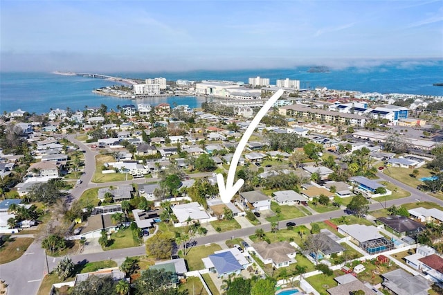 birds eye view of property featuring a water view