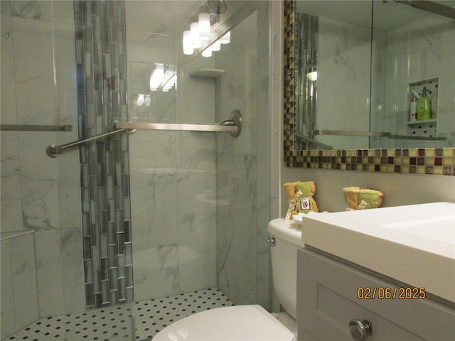 bathroom with a shower with door and toilet