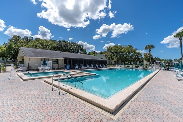 view of swimming pool featuring a patio area