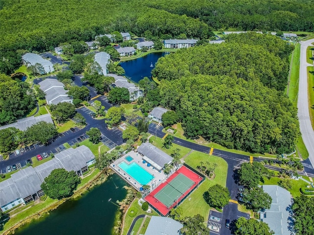 birds eye view of property with a water view