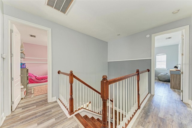 hallway with light hardwood / wood-style flooring