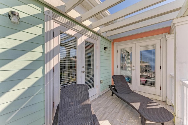 wooden deck featuring french doors