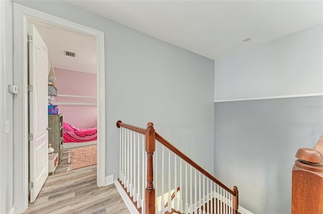 stairway featuring hardwood / wood-style flooring