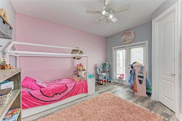 bedroom featuring ceiling fan and light wood-type flooring