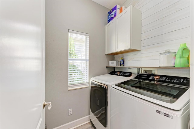 laundry area featuring cabinets and independent washer and dryer