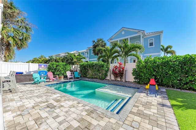 view of swimming pool with a patio area