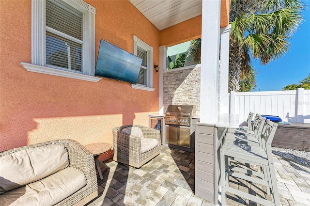 view of patio / terrace with an outdoor kitchen and area for grilling