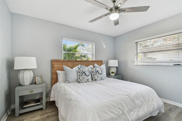 bedroom with hardwood / wood-style floors and ceiling fan