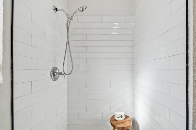 bathroom with tiled shower