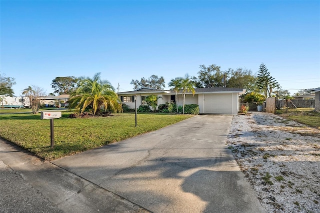 ranch-style house with a garage and a front lawn