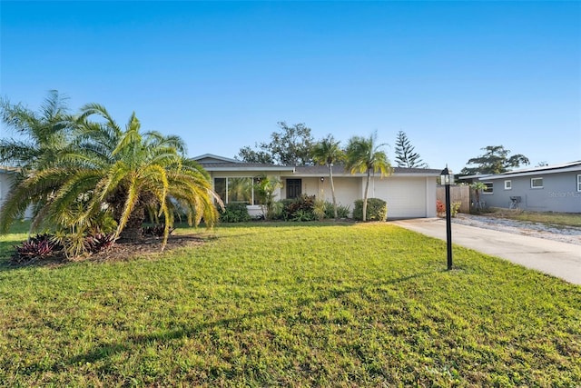 ranch-style house with a garage and a front lawn