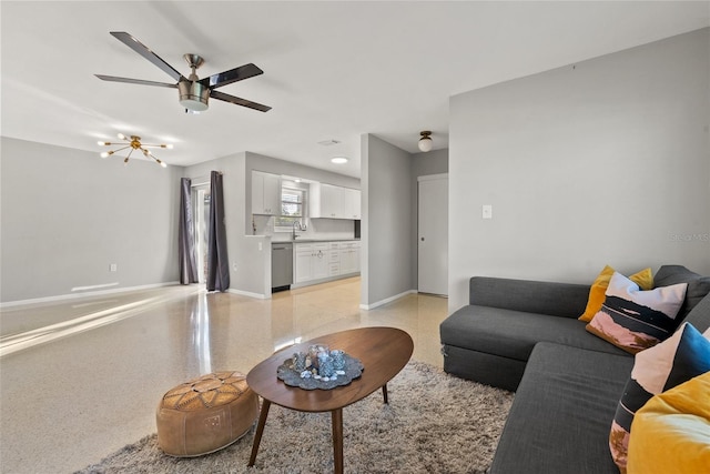 living room featuring sink and ceiling fan