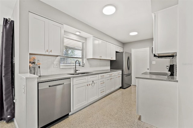 kitchen featuring white cabinetry, sink, tasteful backsplash, and appliances with stainless steel finishes