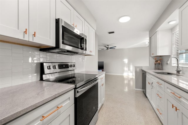 kitchen featuring white cabinetry, appliances with stainless steel finishes, and sink