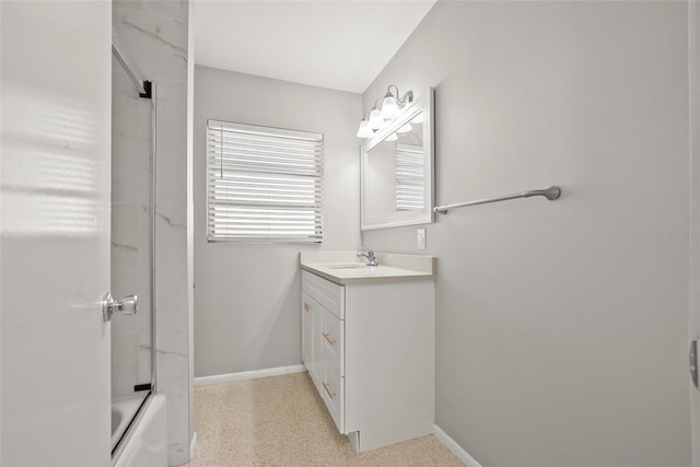 bathroom featuring vanity and combined bath / shower with glass door