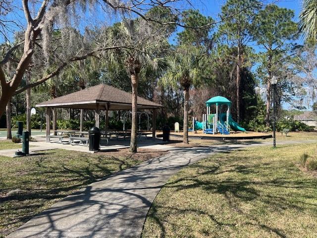 view of jungle gym with a gazebo and a lawn