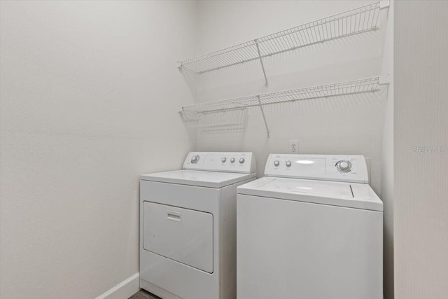 washroom with washing machine and dryer