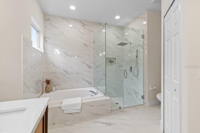 full bathroom featuring vanity, toilet, and separate shower and tub