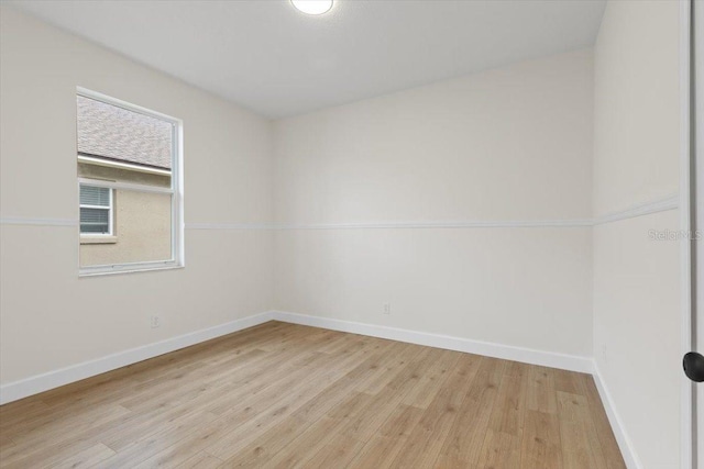 unfurnished room featuring light hardwood / wood-style floors