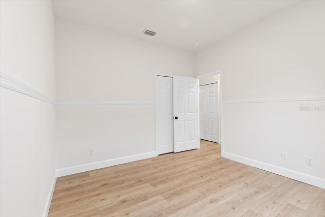 unfurnished room featuring light wood-type flooring