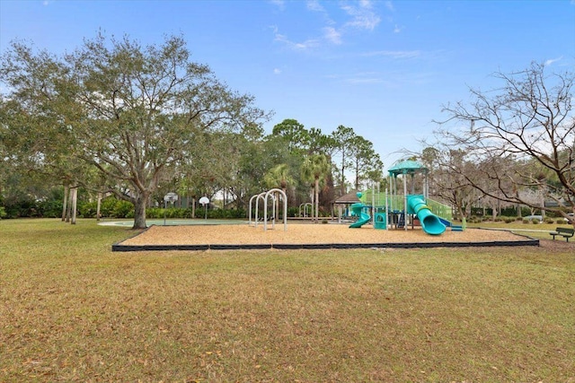 view of jungle gym featuring a lawn